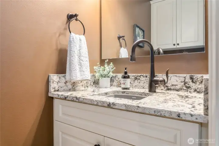 Half bath just off laundry room and garage