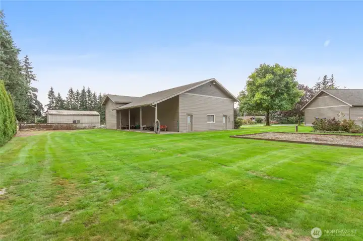 A lean-to off the shop provides space for hobbies or potential horse stalls