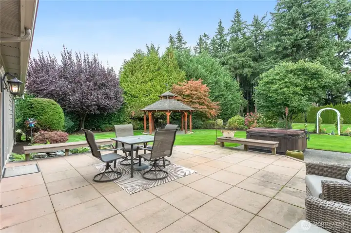 Large patio with lower patio space is a perfect place to entertain