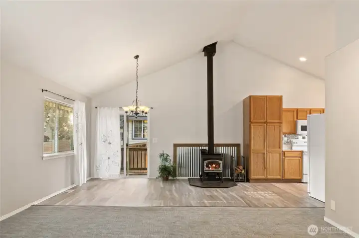 Slider leads to the side and back yard. Nice wood stove to keep you warm all winter! Large pantry cupboard for all your canned goods!