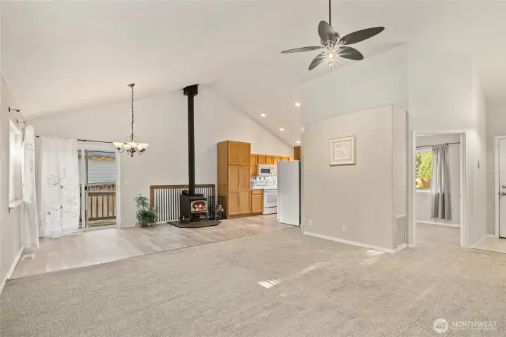 Door on the right is a bedroom. Entry to home is next to it with shoe storage cabinet and coat rack.