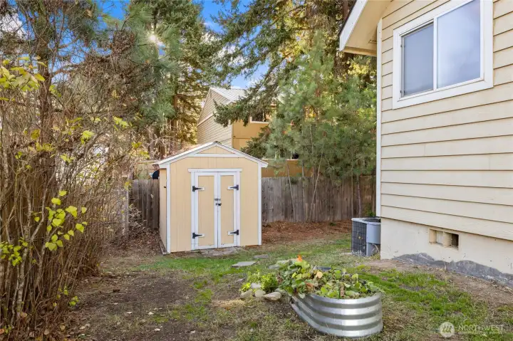 Nice Shed for Tools and Toys! Room for more Raised Garden Bins!