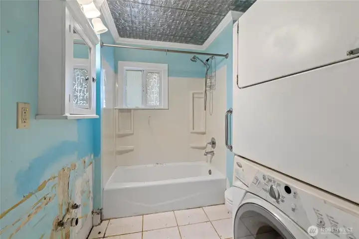 Full bath with stackable washer/dryer (missing sink)