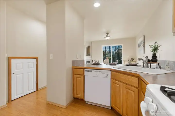 Storage closet tucked underneath the stairs