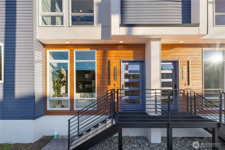 Open iron railings + cedar exterior