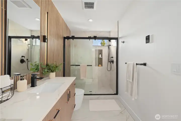 Bathroom has under vanity lighting + heated floors!