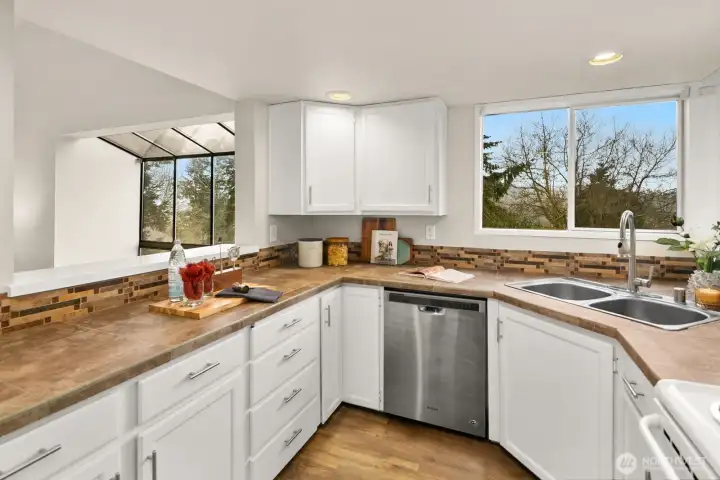 Kitchen features pass through to dining area, keeping everything connected.