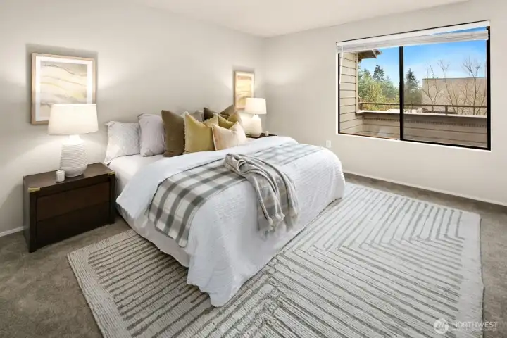 Primary suite sits at back of unit, overlooking balcony.