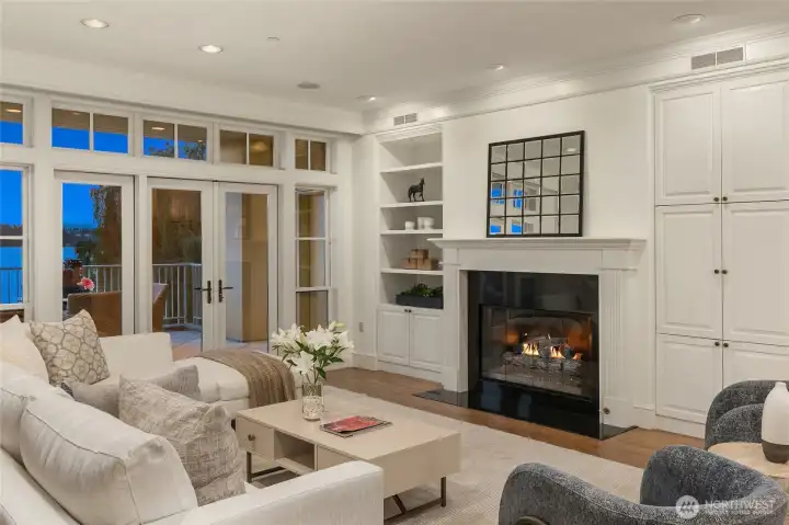A cozy fireplace anchors the living room, creating a warm and inviting gathering space.