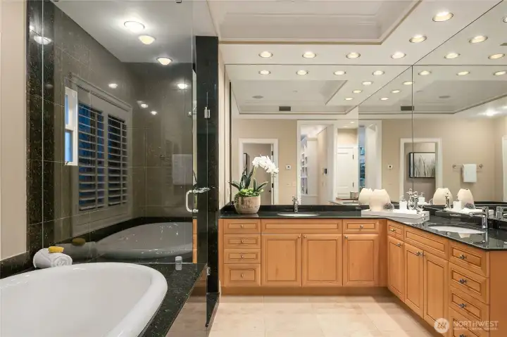 The primary bathroom includes a soaking tub, clean finishes, and thoughtful design throughout.