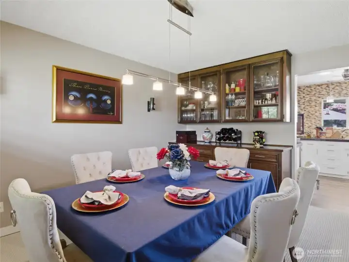 Here is a great place to enjoy friendships and great food!  A built in buffet and china cabinet has an incredible amount of storage space.