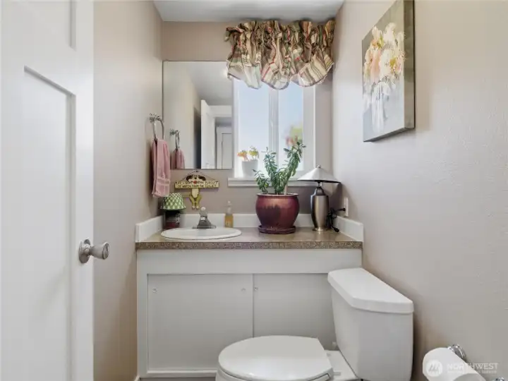 half bath between laundry room/back door and garage door for easy access from inside outside.