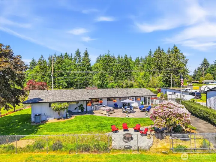 The property is fenced completely dividing up areas.  Large gates allow access to each of the 3+ acres.