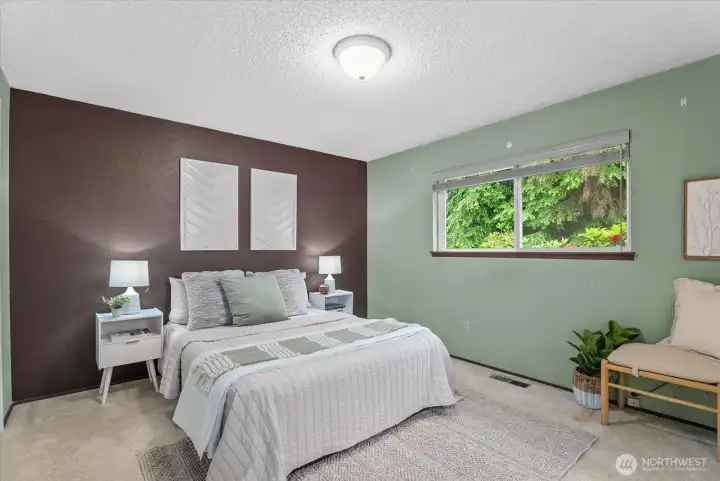 Spacious primary suite offers a relaxing retreat