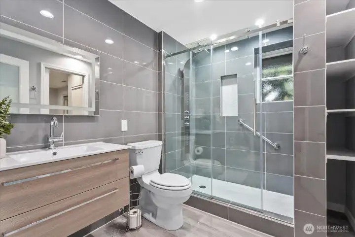 Beautifully remodeled bathroom with designer tile accents