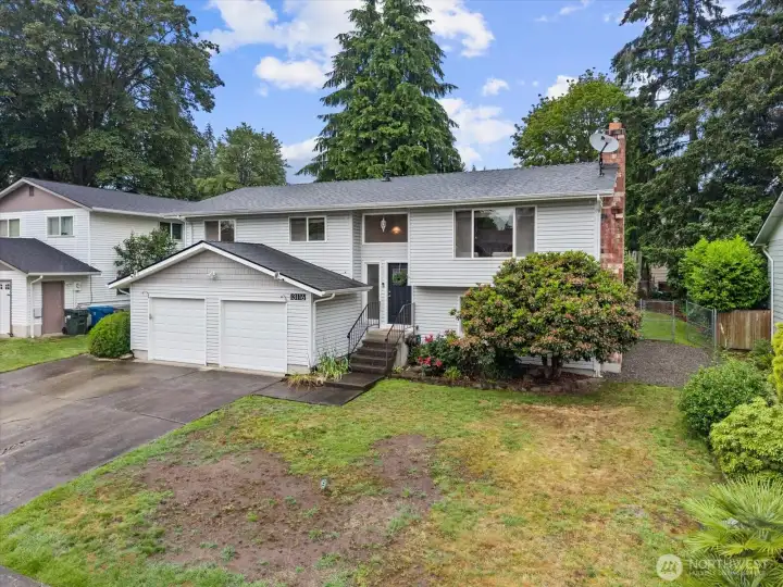 Charming curb appeal with mature landscaping