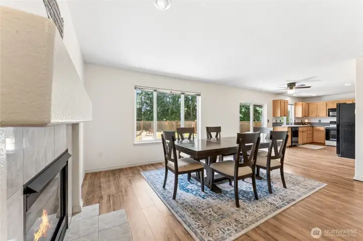 Open dining area with flexible use as a formal dining room or sitting area, complete with a gas fireplace. Open dining area with flexible use as a formal dining room or sitting area, complete with a gas fireplace.
