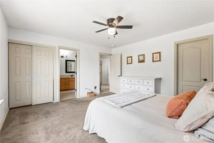 Spacious primary bedroom featuring a walk-in closet and an additional storage closet for extra organization. Spacious primary bedroom featuring a walk-in closet and an additional storage closet for extra organization.