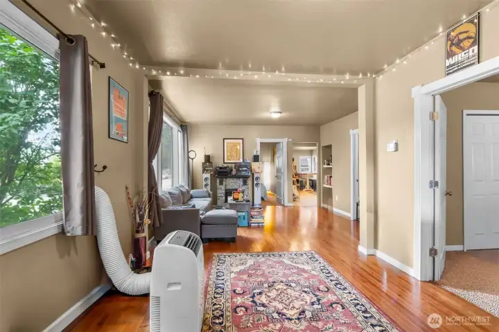Over sized widows allows for plenty of natural lighting. Hardwood floors in the main living area. Over sized widows allows for plenty of natural lighting. Hardwood floors in the main living area.