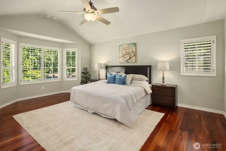 Spacious Primary bedroom with hardwood floors, large windows, and generous natural light. Spacious Primary bedroom with hardwood floors, large windows, and generous natural light.