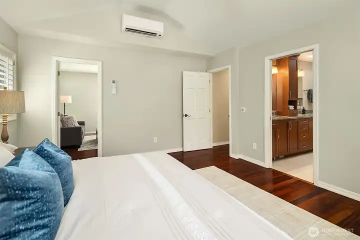 Primary bedroom features mini-split comfort, hardwood flooring, and flexible use. Primary bedroom features mini-split comfort, hardwood flooring, and flexible use.