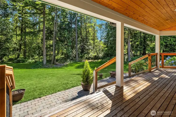 Covered wraparound deck extends the living space and overlooks the backyard Covered wraparound deck extends the living space and overlooks the backyard