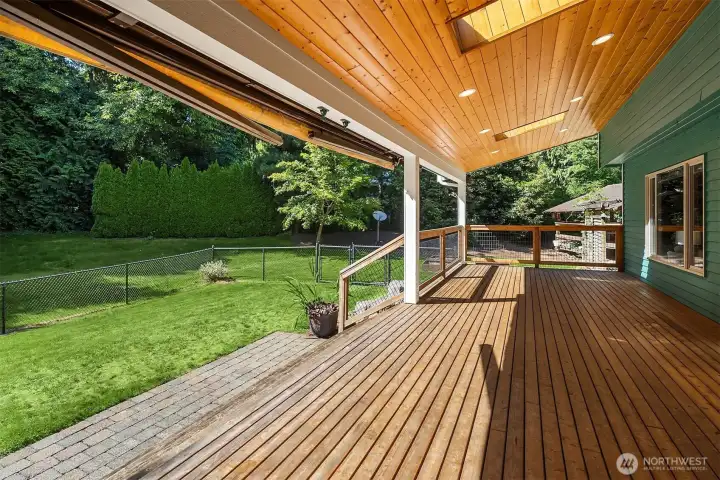 Covered outdoor living area provides year-round enjoyment with views of the surrounding property Covered outdoor living area provides year-round enjoyment with views of the surrounding property