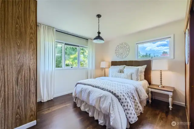 Look at how lovely the floors are in this nice light and bright bedroom