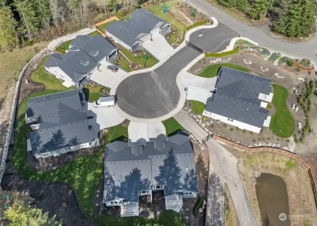 Westbury's gate is off 138th Ave. the 4 homes at the top of the photo were built/sold in 2023. Community mailboxes are directly outside the gate.