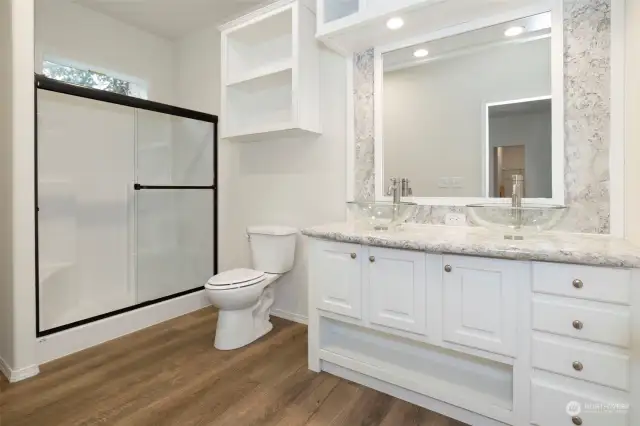 Deluxe Primary bathroom with oversized shower and window overhead