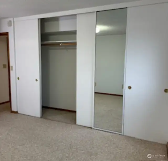 Primary with room length closet with mirrors