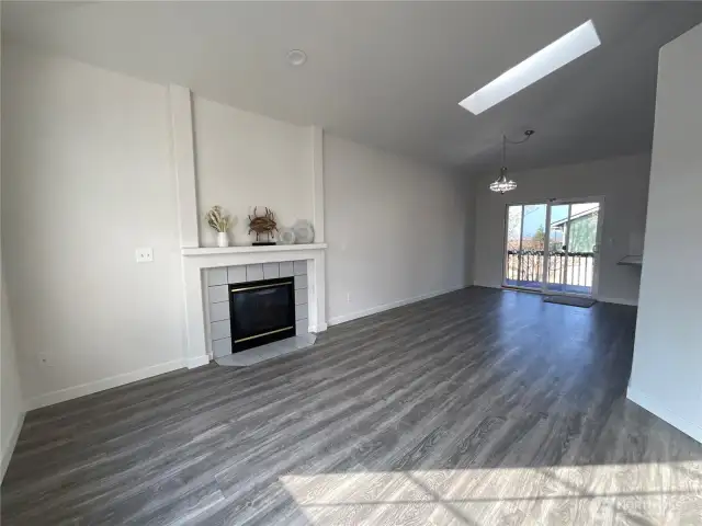 Living room/reception room with cozy fireplace