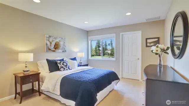Bright secondary bedroom with walk-in closet.