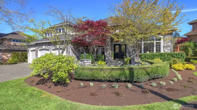 Immaculately maintained lush landscaping for beautiful curb appeal