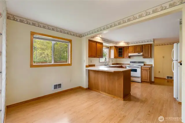 Dinning room wraps into the kitchen and pantry area.