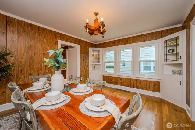 Notice the stunning built-in cabinets with leaded glass doors, display shelves and storage!