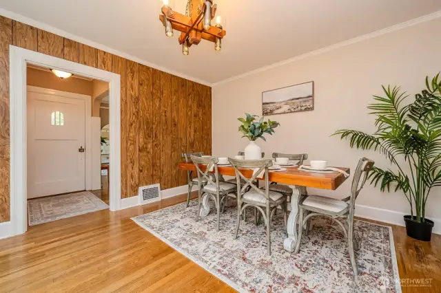 Looking back through through the Dining Room and into the Entry you notice the charming peek a boo window in the front door and the proximity to the Living Room around the corner.