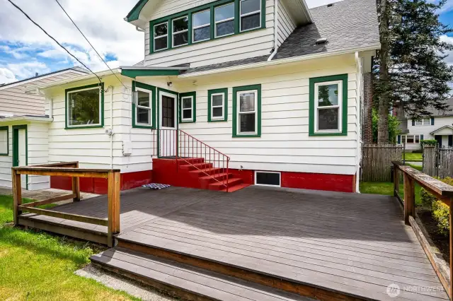 Another photo of the backyard deck and the sideyard with gate to the front yard.