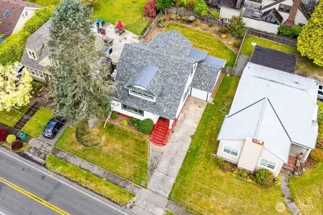 This charming vintage beauty is nestled among a picturesque row of early 20th century gems! A new roof and gutters were installed in 2024 and the home was freshly painted inside and out as well.