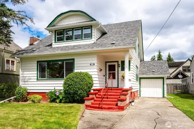 Full of storybook charm, this home features classic cedar siding, a warm welcoming red front porch, a 1-car gararage/storage area and a distinctive eyebrow dormer that adds timeless character and curb appeal.