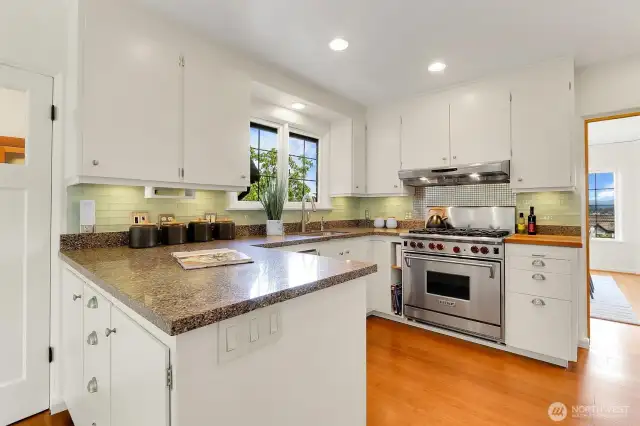 Remodeled Kitchen Shows Granite Counters, A Full Set of Stainless Steel Appliances & Spacious Breakfast Nook!