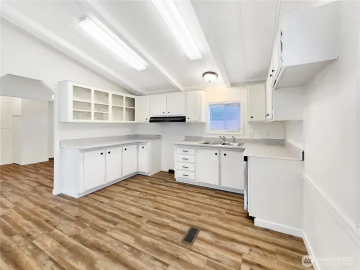 Durable & Stylish: Easy-care luxury vinyl plank flooring adds modern style and lasting durability.