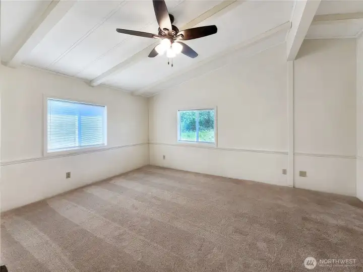 Back-of-Home Comfort: The primary bedroom offers a private, peaceful setting away from the main living areas.