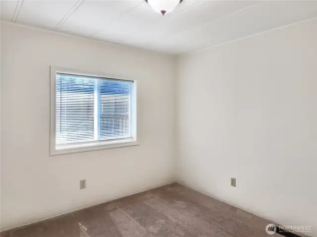Just Right Lighting. Blinds in the bedroom provide flexible light control and added privacy.