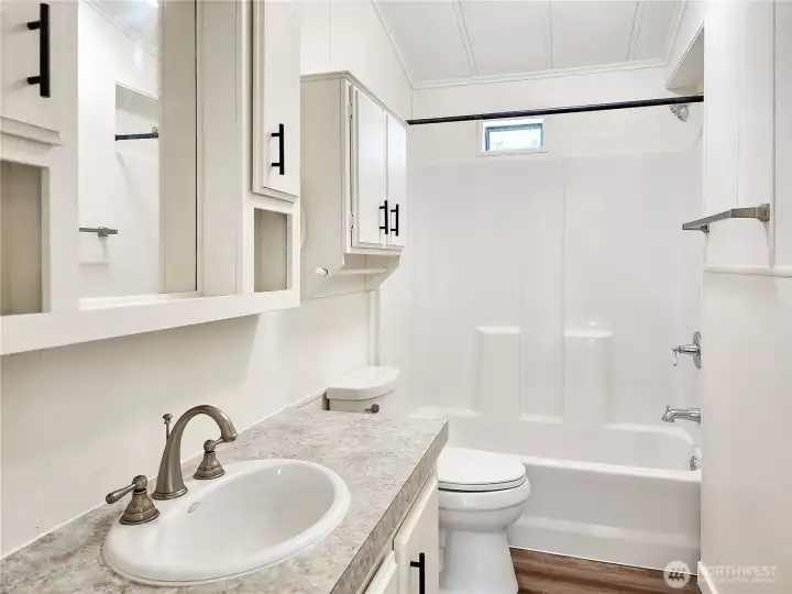 eautifully renovated with a new tub/shower unit, porcelain sink, and updated fixtures.