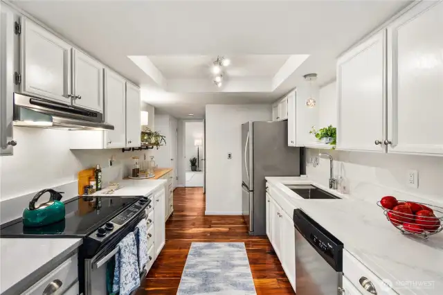 Remodeled kitchen with newer appliances, fixtures and deep sink