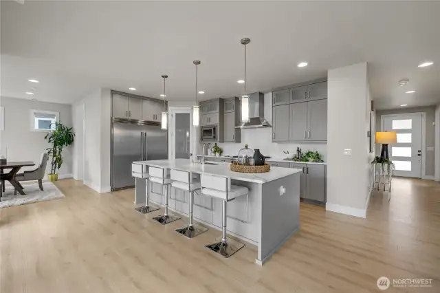 Premium stainless steel appliances throughout the kitchen.