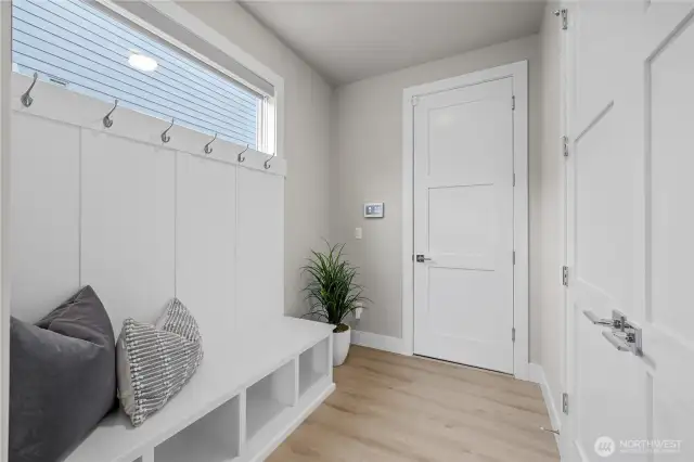 Mudroom with storage closet and garage access – perfect drop zone.