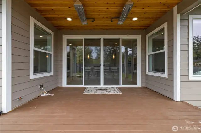 Covered patio with built-in ceiling heater for year-round enjoyment.