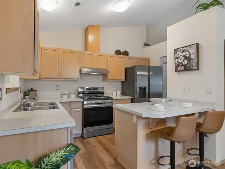 Brand new range and refrigerator. Pantry in wall on right